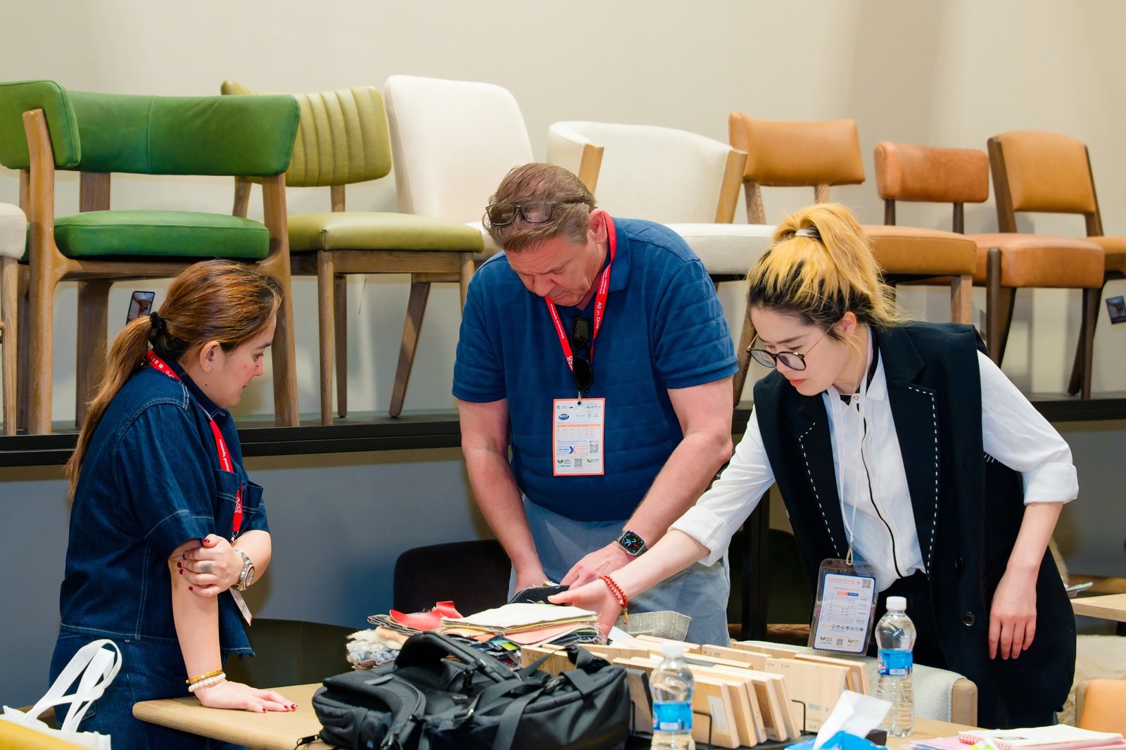 Industry networking - sourcing professionals sitting and talking together in a conference room